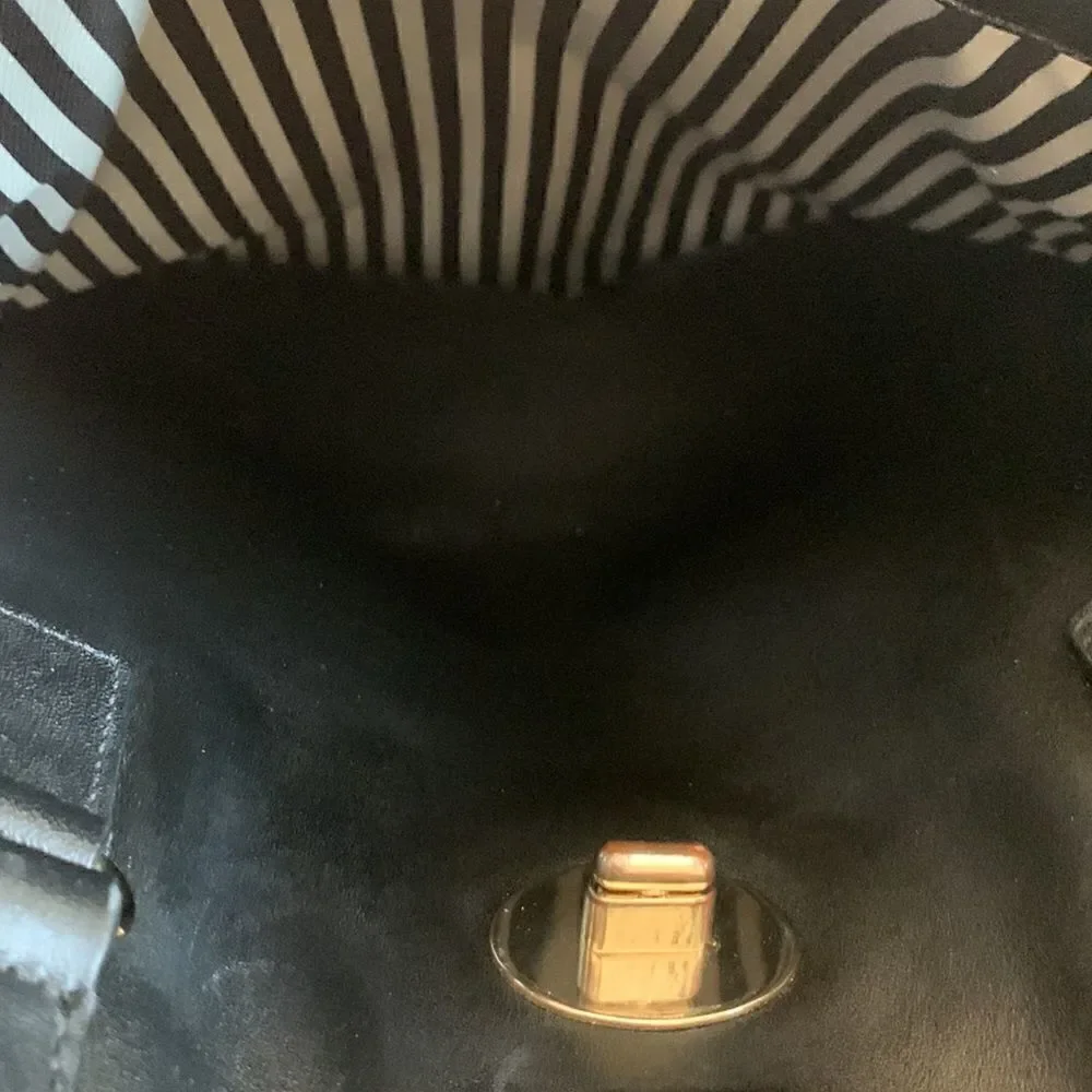 Kate Spade black leather tote bag with exterior and interior pockets